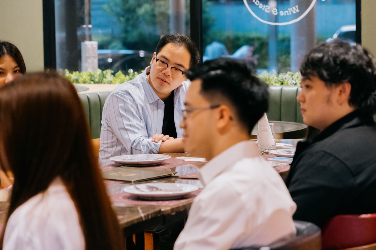 Members of the circle gathered around the table at the end of an evening